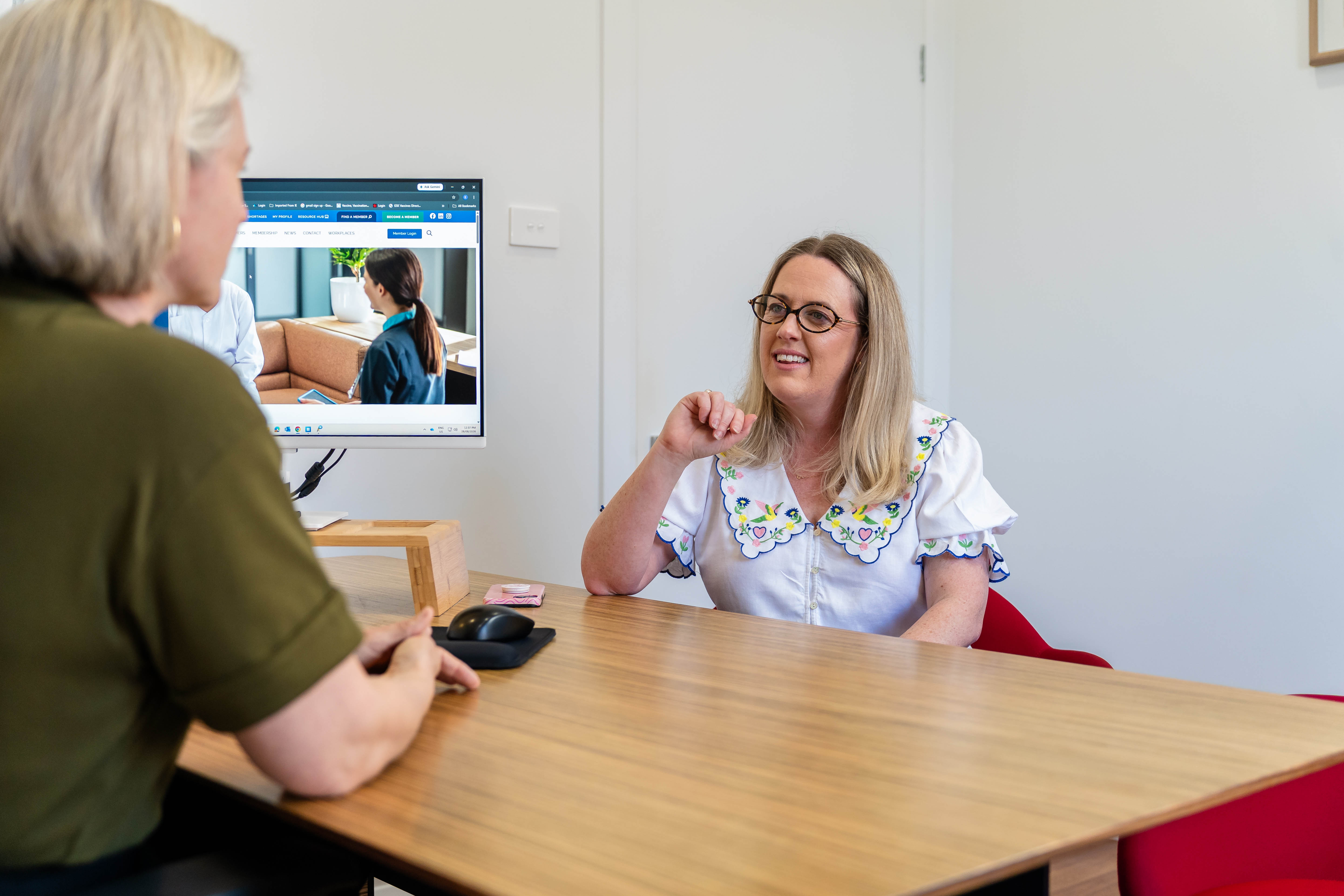 A woman consulting with Dr Kimberley Elliott